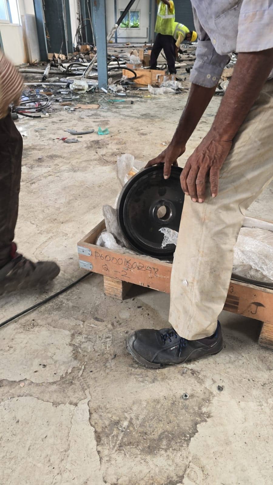 Team member handling equipment during a site clearance